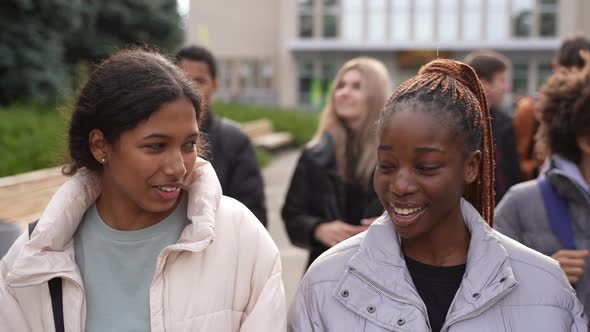 Happy Teens Enjoying Chatting Outdoor After Study