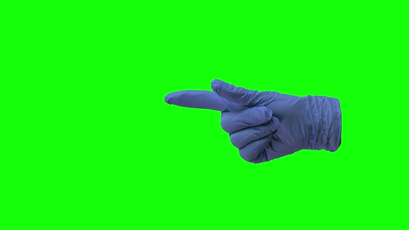 Doctors Hand in Blue Glove Is Making Symbolic Gestures Pointing Something. Green Screen. Close Up