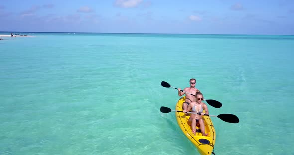 Fun couple after marriage in love enjoy life on beach on white sand 4K background