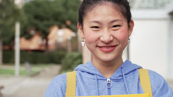 Positive Young Asian Woman