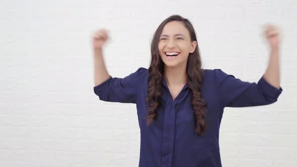 Excited Indian girl cheering