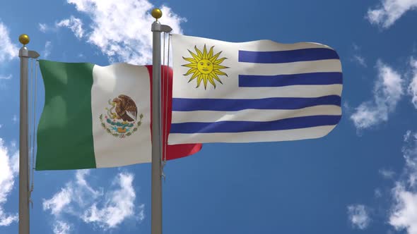Mexico Flag Vs Uruguay Flag On Flagpole