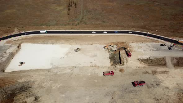 Aerial Road Constructions, Machinery and Mine Equipment Near Road on Sandy Surface alt