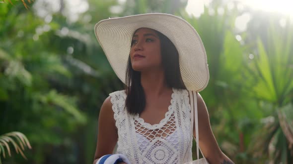 Young Woman In Sun Hat Walking Along On Nacpan Beach