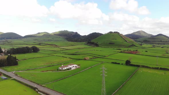 4k Drone footage panning the landscape of the beautifully luscious green farming fields of Azores
