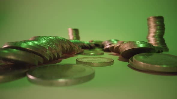 Rows of Coins Cash Lie on White Surface at Green Light