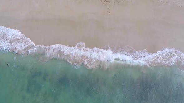 Aerial view of the beach and ocean in Hawaii.