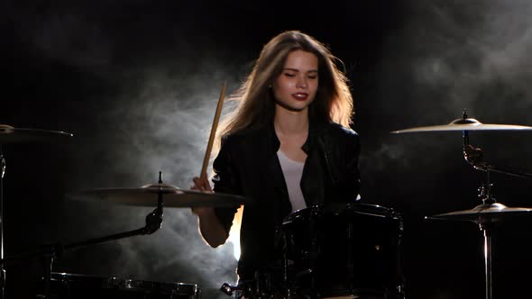 Girl Plays the Drum She Likes To Pound on Pancakes, Black Smoke Background