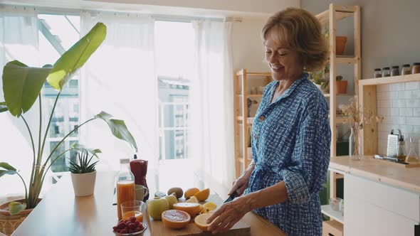 beautiful senior woman spending time in her cozy apartment