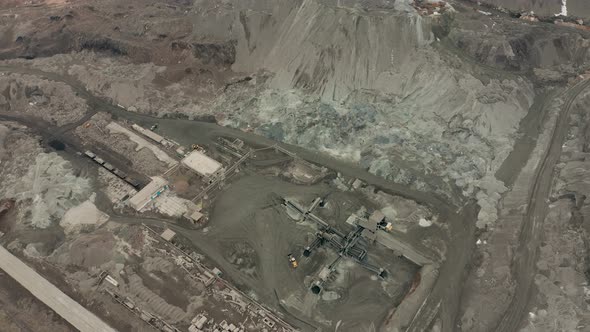 Aerial View of Opencast Mining Quarry with Lots of Machinery at Work - View From Above. Slag Pit