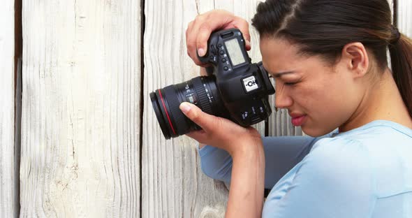 Photographer taking photo with digital camera