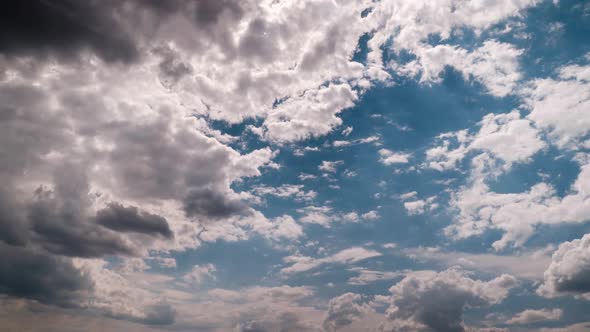 Timelapse of Puffy Layered Clouds Moving in the Blue Sky Cloud Space
