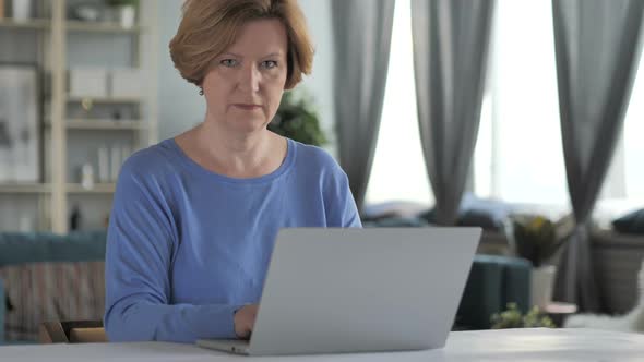 Amazed Surprised Old Senior Woman Wondering at Work