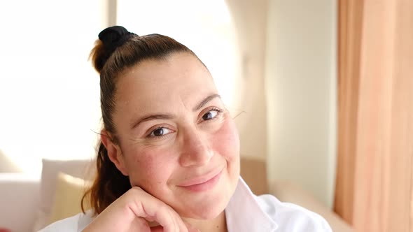 Middle Aged Turkish Woman Looking At The Camera And Smiling