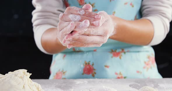 Woman preparing a dough ball 4k