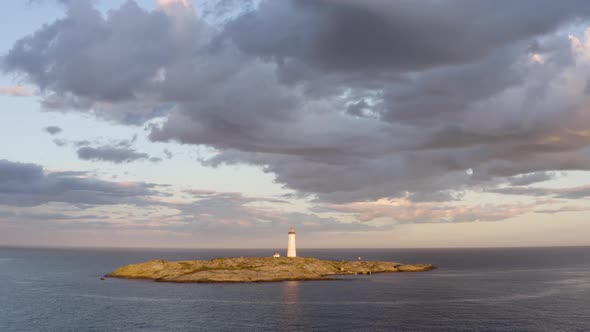 Stormy Sky Over Lille Torungen Lighthouse In Arendal, Agder County, Norway - aerial drone shot