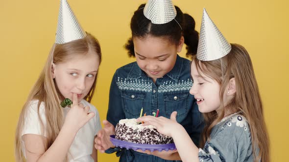 Kids with Birthday Cake Celebrating Birthday Copy Space Orange Background