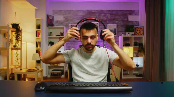 Pov of Young Man Putting His Headphones