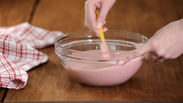 Baker Making Strawberry Mousse For Cake