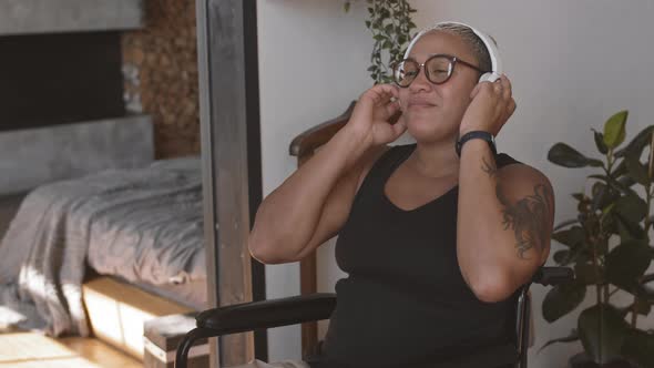 Handicapped Woman Enjoying Music in Headphones