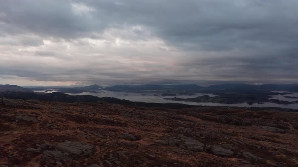 Leroyosen waters and Flesland Bergen airport in the background - Late night moody cloudy aerial clos