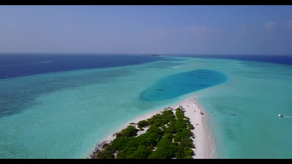 Aerial abstract of relaxing island beach voyage by clear lagoon with white sandy background of a day