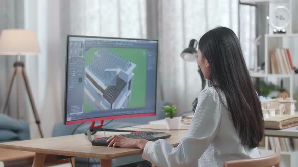 Woman Engineer Design And Zoom In 3D House With Solar Panel While Working On A Desktop At Home
