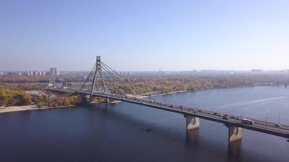 Aerial: Traffic on Pivnichniy bridge in Kiyv, autumn time