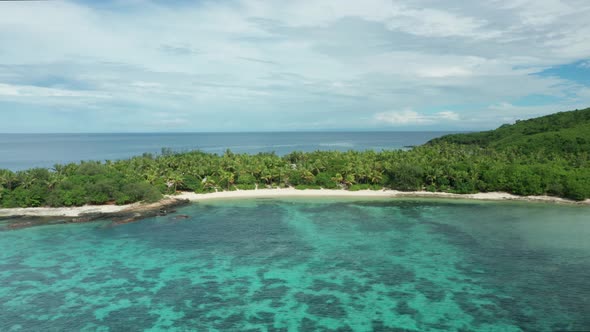 A Scenic View At Fiji Island With A Crystal Clear Water And Green Forest On A Sunny Summer Day.-aeri