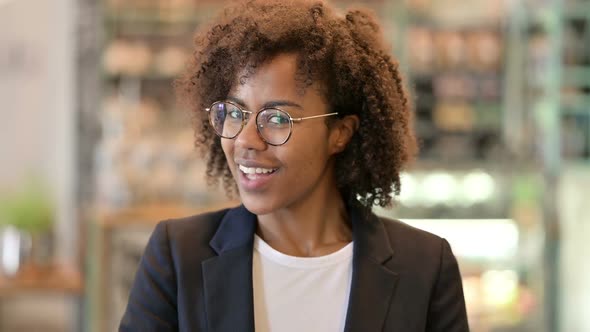 Assertive African Businesswoman with Pointing with Finger