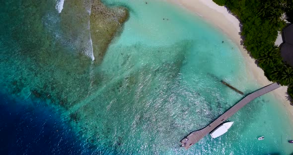 Luxury above travel shot of a sunshine white sandy paradise beach and blue ocean background in color