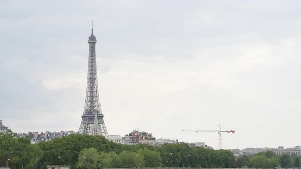 French famous Eiffel tower near river Seine by the day slow tilt 4K 2160p 30fps UltraHD video - Tilt