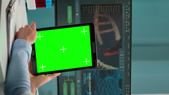 Vertical Video Scientist Holding Tablet with Green Chroma Key Screen