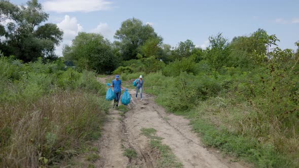 Eco Activists Volunteers Clean Up Garbage In The Nature