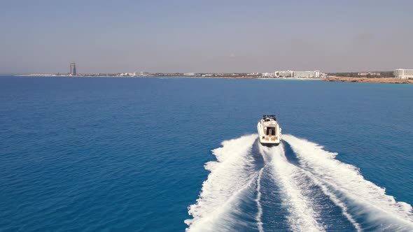 Drone Aerial Footage of Speedboat in the Blue Turquiose Mediterranean Sea in Cyprus Summer