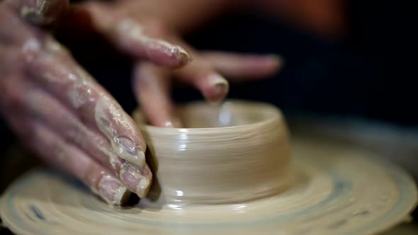 Closeup of the Hands of a Potter's Wheel Clay Potter Craft