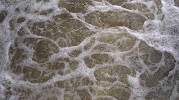 Bubbling Water with Foam in a River or Lake