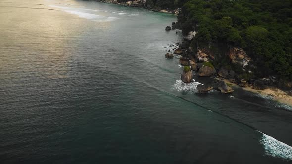 Beautiful Bingin beach with exotic cliffs houses and hotel located in Bali, Indonesia. This drone fo