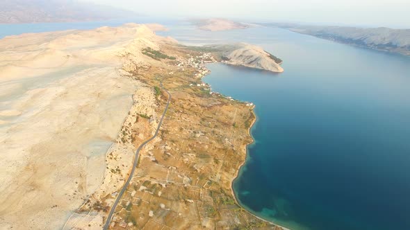 Aerial view of road through barren landscape of Pag island in Croatia