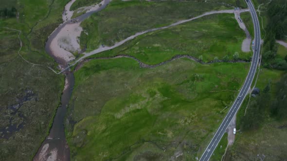 Car drive along a winding road in the Scottish highlands