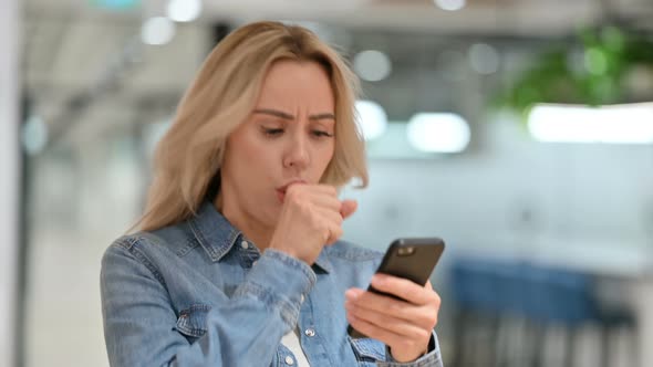 Sick Casual Woman with Smartphone Coughing