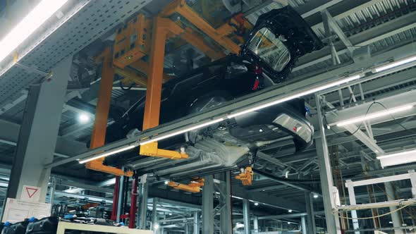 Car Body Moves Along a Production Line at a Car Manufacturing Plant