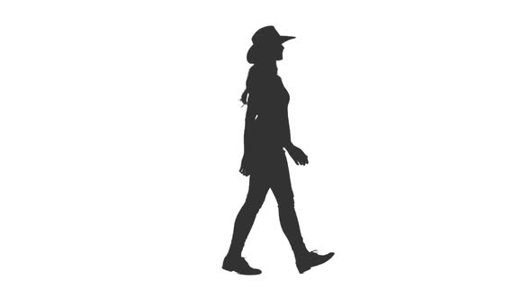 Silhouette of Young Attractive Woman Walking in Cowboy Hat alt