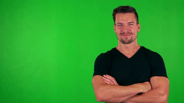 Young Handsome Caucasian Man Smiles To Camera with Folded Arms - Green Screen