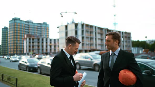 Two Architect Discuss New Building and Make Handshake.