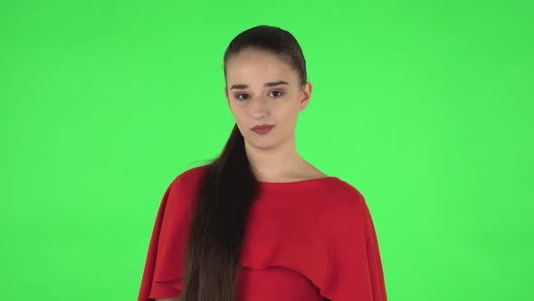 Portrait of Pretty Young Woman Is Frustrated Saying Wow. Green Screen