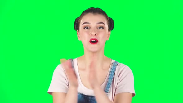 Girl with Two Hair-buns Claps Her Hands with Wow Happy on Green Screen. Slow Motion