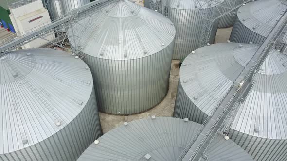 Grain elevator in agricultural zone. Row of granaries for storing wheat and other cereal grains