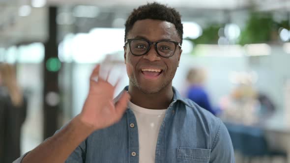 Portrait of Young African Man Talking on Online Video Call