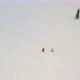 Aerial View of a Two Friends Skiing and Snowboarding Down a Mountain. - VideoHive Item for Sale